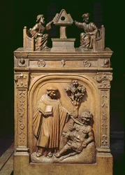 Choir stalls depicting two writers at a lectern and a scene of exorcism